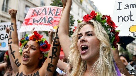 Topless activists from Ukraine's Femen group protest in Paris