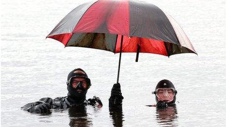 John Greener and Naomi Fisher from the Kendal and Lakes Sub-Aqua Club with umbrella