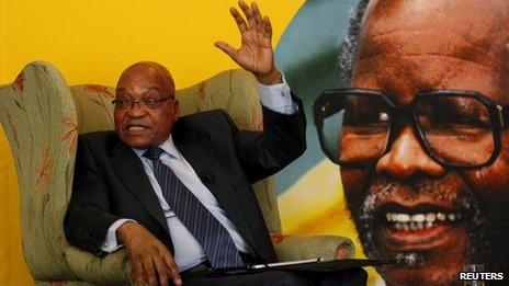 South African President Jacob Zuma sitting in front of a portrait of late African National Congress (ANC) President Oliver Reginald Tambo, during a briefing with the South African Foreign Correspondents Association in Johannesburg - 29 October 2012