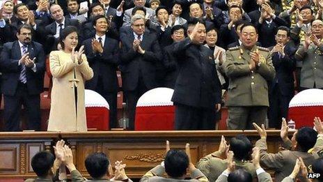 North Korean leader Kim Jong-un (C), with his wife Ri Sol-ju wearing a beige coat, watching a concert in Pyongyang, 29 October 2012