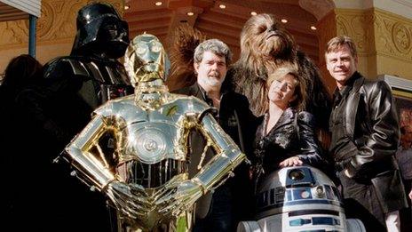 George Lucas (centre) with Carrie Fisher, Mark Hamill (right) and other Star Wars regulars in 1997