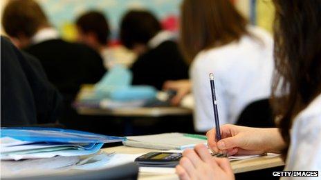 Students working at desks in a classroom