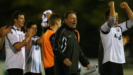 Cambridge City's management and players celebrate