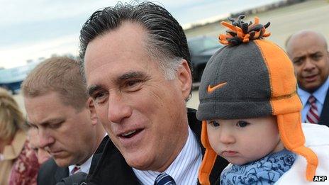 Mitt Romney with a supporter's baby in Newington, New Hampshire, on 3/11/12