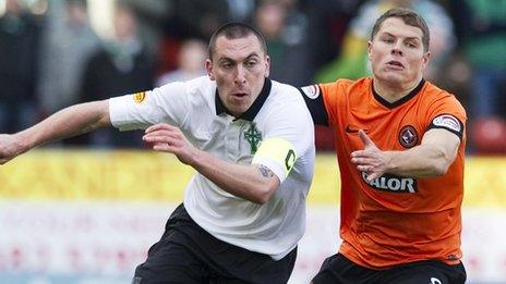 Celtic skipper Scott Brown jousts with United's John Rankin