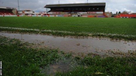 Whaddon Road's flooded pitch on Sunday