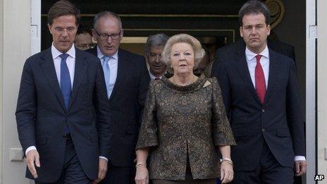 Prime Minister Mark Rutte (left) with Queen Beatrix and members of his government at the royal palace in The Hague on 5/11/12