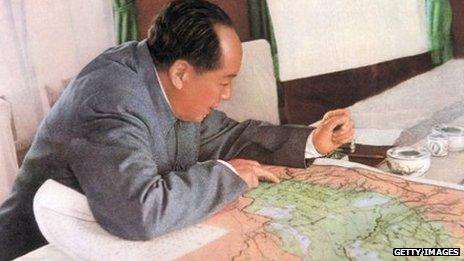 retouched picture of the leading theorist of the Chinese communist revolution, Chairman of the Party and President of the Republic Mao Zedong reads a map in his private train compartment in 1963.