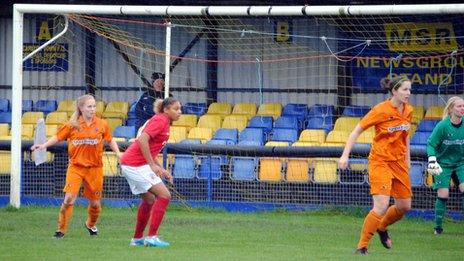 Forest player waiting for the ball near the goal