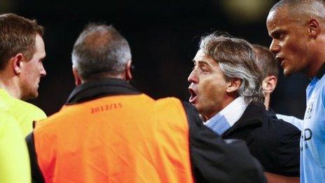 Manchester City boss Roberto Mancini remonstrates with officials at the final whistle