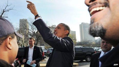 US President Barack Obama greets supporters outside a campaign office in Chicago, Illinois