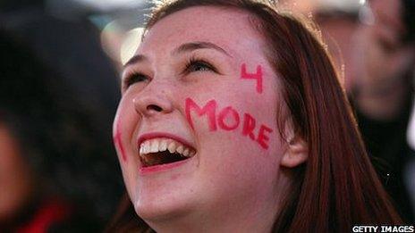 A delighted Obama supporter watches the results in New York