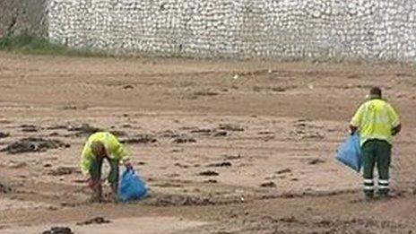 Beach cleaners on a beach in Thanet