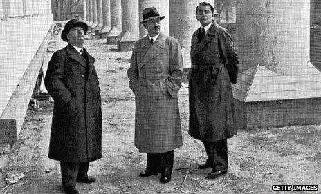 Hitler (centre) in hat and coat