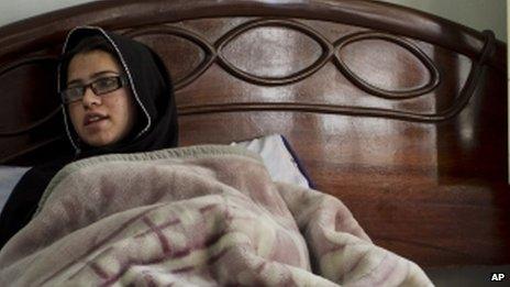 Pakistani schoolgirl Kainat Riaz recuperating in bed after the Taliban attack on her school bus