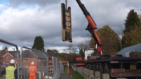 The new lock gates being lowered into place