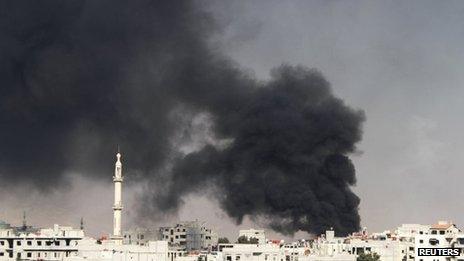 Smoke rises from the eastern Damascus suburbs of Arbeen, after what activists say was an air strike by a MIG fighter jet, 8 November 2012