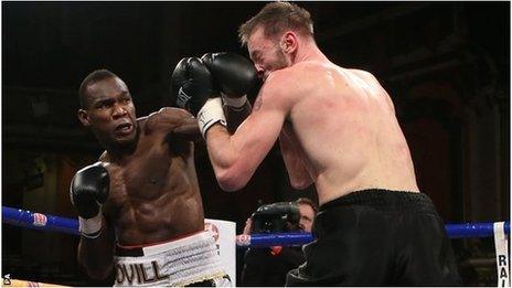 Ovill McKenzie lands a solid left on Enzo Maccarinelli