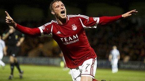 Chris Clark celebrates knocking home Aberdeen's third goal in Paisley