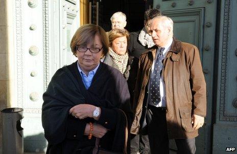 Members of the De Vedrines family leave court in Bordeaux, south-west France, 13 November