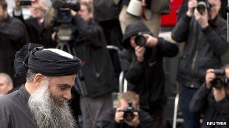 Abu Qatada arrives back at his home in London