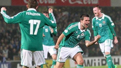 David Healy (second from right) celebrates after scoring the equaliser