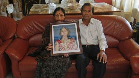 Savita Halappanavar's parents hold their daughter's picture