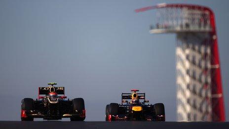 Romain Grosjean (left) and Sebastian Vettel of Germany