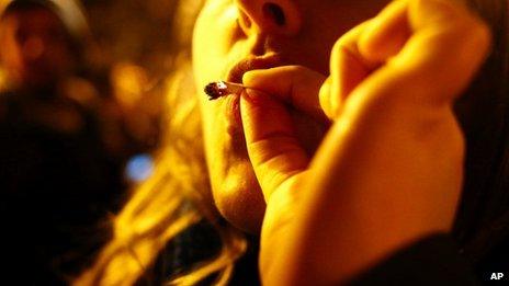 A woman smokes marijuana in Seattle on Tuesday 6 November