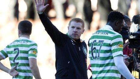 Neil Lennon salutes the visiting fans at Pittodrie