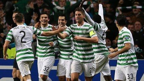 Celtic players celebrate goal against Barcelona