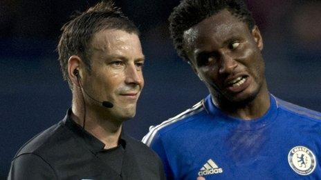 Chelsea's Jon Mikel Obi (R) complains to referee Mark Clattenburg