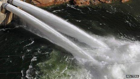 Water pours from river outlet tubes during an experimental high flow release from the Glen Canyon Dam in Page, Arizona