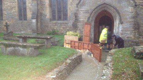 Floodwater being diverted away from a church in Leonard Stanley