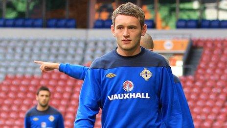 Northern Ireland defender Lee Hodson has joined Brentford on loan