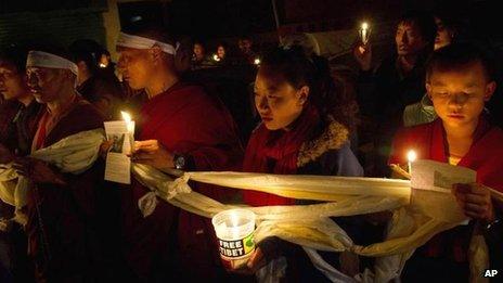 Tibetan exiles participate in a candlelit vigil in solidarity in Dharmsala, India, after reports of a self-immolation in northwestern China's Gansu province, 13 Oct 2012