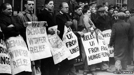 Unemployed men chained to the railings at the Labour Exchange in Settle Street, London, in January 1939