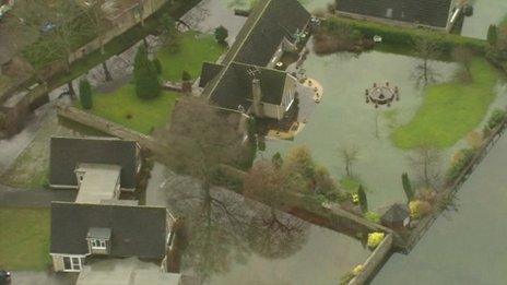 Homes in Cirencester surrounded by flood water