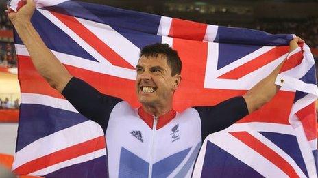 Mark Colbourne celebrates after winning a track C1 3km Individual Pursuit gold medal at the 2012 Paralympic Games