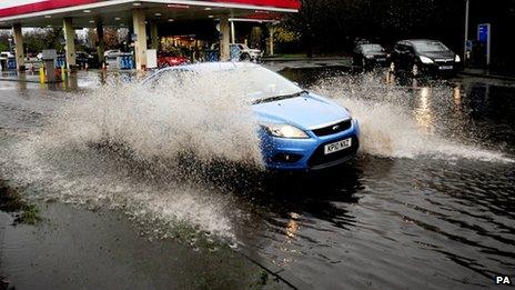 A car drives through floodwater on the A1 in North Yorkshire