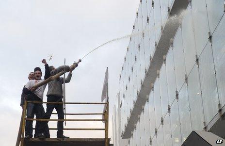 Dairy farmers hose the European Parliament in Brussels with milk, 26 November