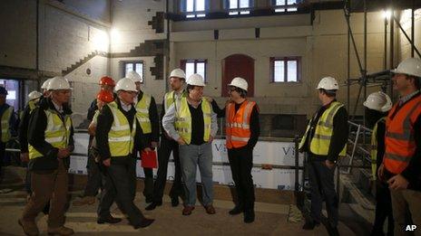 Members of the team behind the new indoor venue at Shakespeare"s Globe gather to pose for a group photograph for the media during a publicity event in London