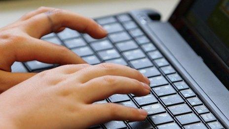 Hands on a computer keypad