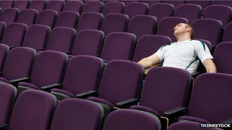 Student asleep in a lecture hall