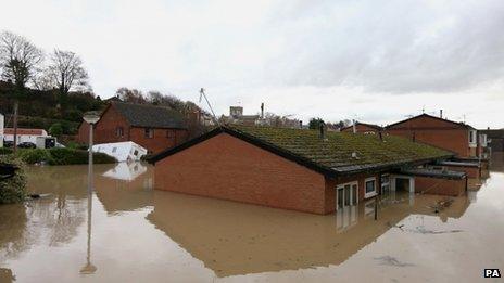 Flood waters come close to covering houses in St Asaph, Denbighshire on Tuesday