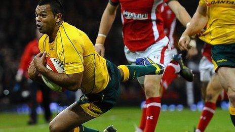 Kurtley Beale of Australia dives to take the ball during the International match between Wales and Australia