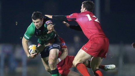 Connacht's Robbie Henshaw is tackled by Nick De Luca and Matt Scott of Edinburgh