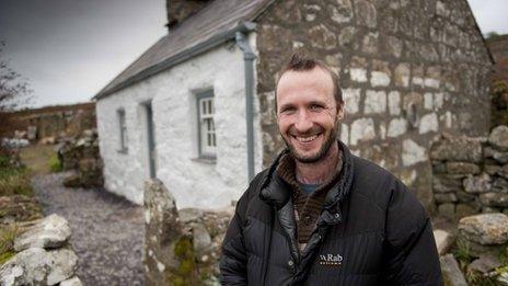 The National Trust's Andrew Godber outside the crofter's cottage