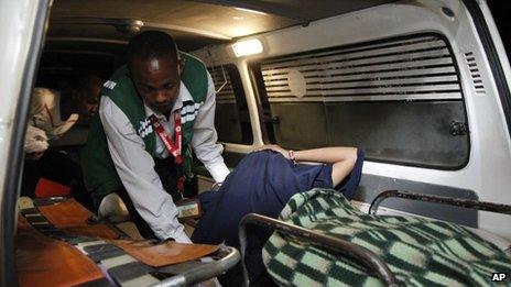 An unidentified victim is brought to a hospital after an explosion in Nairobi, Kenya
