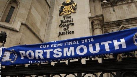 A Portsmouth scarf on the railings outside the Royal Courts of Justice